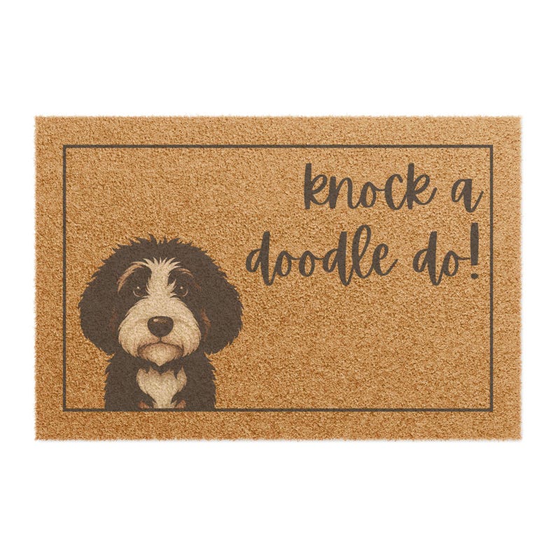 May include: A rectangular doormat with a brown background and a black border. The mat features a black and white dog illustration on the left and the phrase "knock a doodle do!" in black script on the right.