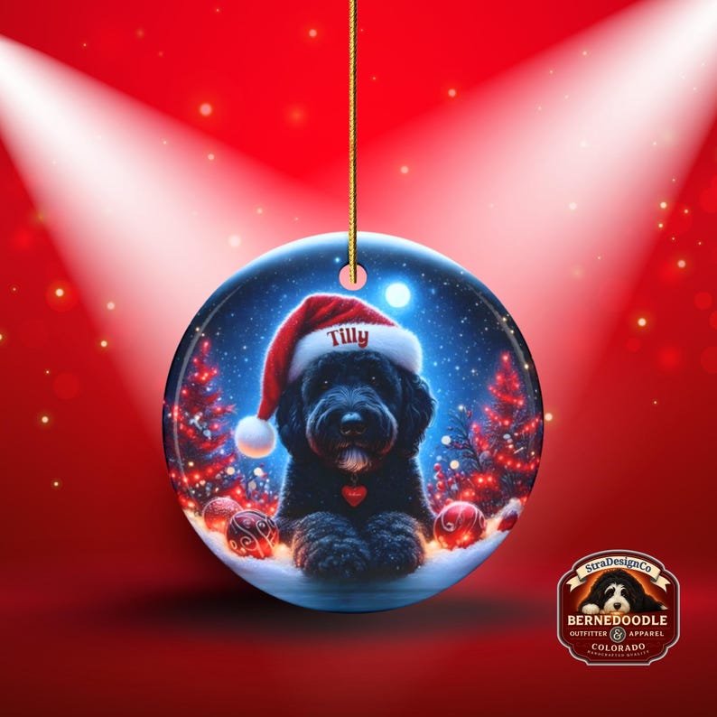 This festive ornament features an adorable black doodle wearing a Santa hat, surrounded by soft glowing holiday lights and rich red Christmas tones. The warm lighting highlights the dog’s fluffy black fur, giving the design a bright, cheerful look that stands out on any tree. A perfect personalized keepsake for anyone who loves black doodles and joyful holiday décor.