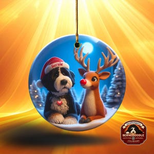 A fluffy Bernedoodle sits beside a gentle reindeer with a glowing red nose in a snowy winter forest. Soft blue and golden holiday lighting highlights the animals as snow falls around them. The Bernedoodle’s expressive face and the reindeer’s warm glow create a peaceful, magical Christmas scene perfect for woodland and dog-themed holiday décor.