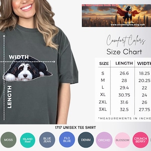 May include: Dark grey unisex t-shirt featuring a black and white dog graphic. The shirt includes a size chart with measurements in inches. Available colors include black, moss, and white. The shirt is labeled as "1717 UNISEX TEE SHIRT."