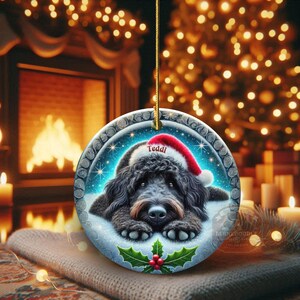 Black goldendoodle ceramic ornament with two sided design.  Black golden doodle , black bernedoodle dog decor.  The picture is showing the ornaments printed on each side.  Gorgeous blue ornament with black doodle dog wearing a santa hat.  Personalized with dog's name.