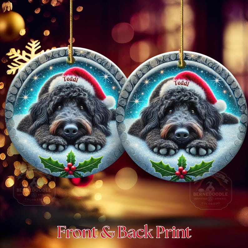 Black goldendoodle ceramic ornament with two sided design.  Black golden doodle , black bernedoodle dog decor.  The picture is showing the ornaments printed on each side.  Gorgeous blue ornament with black doodle dog wearing a santa hat.  Personalized with dog's name.