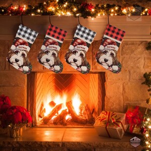 A festive Christmas stocking featuring a whimsical illustrated doodle dog wearing a red Santa hat, surrounded by holiday ornaments and greenery in a warm, detailed Christmas art style. The top of the stocking has a classic red and black buffalo-plaid cuff, and the stocking hangs from a white mantel decorated with evergreen garland and gold ornaments. The stocking design is personalized with your dog’s name, making it a charming and custom holiday décor piece for dog lovers.