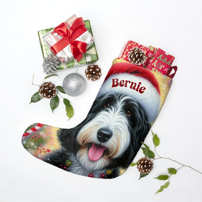 Bernedoodle Christmas stocking with a cute black and white dog wearing a Santa hat and smiling, personalized with the name ‘Bernie’. Festive holiday background with candy canes, lights, and ornaments — perfect personalized dog lover gift, Bernedoodle holiday décor, or custom pet Christmas stocking.