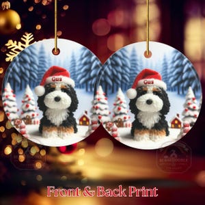 Bernedoodle claymation style ornament made of ceramic, hanging by a gold string.  Winter scene featuring a cute, personalized doodle dog with personalized name on santa hat.  Perfect gift for Bernedoodle Dog Lovers and Pet Enthusiasts.  Picture of bernedoodle ornament front and back design.