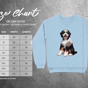 A size chart for a GILDA 18000 heavy blend crew neck sweatshirt, with a blue dog image on the front.