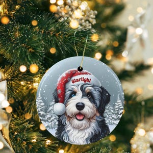 Merle Bernedoodle Ceramic Ornament, showcasing stunning blue and brown eyes. Personalized ornament with your dogs name