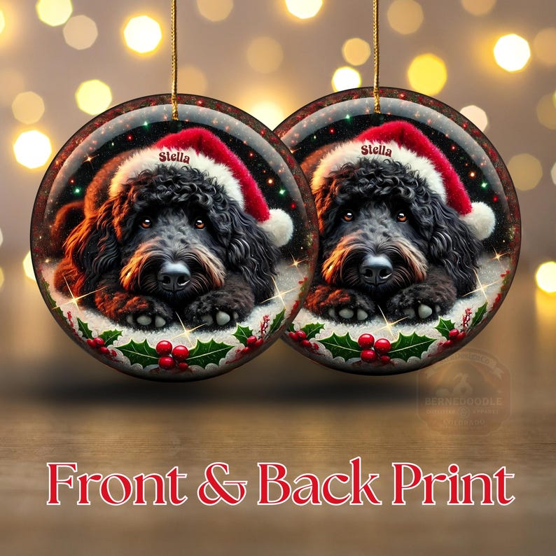Black bernedoodle or labradoodle dog ceramic ornament show hanging with a gold string.  The ornament measures 3 inches in diameter and is a full gloss, printed on both sides.