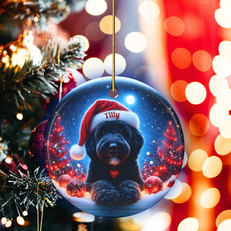 This festive ornament features an adorable black doodle wearing a Santa hat, surrounded by soft glowing holiday lights and rich red Christmas tones. The warm lighting highlights the dog’s fluffy black fur, giving the design a bright, cheerful look that stands out on any tree. A perfect personalized keepsake for anyone who loves black doodles and joyful holiday décor.