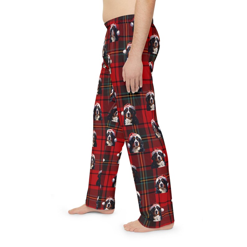 Men's pajama pants lounge wear personalized Christmas pajama bottoms with Bernese Mountain dogs wearing Santa Hat and their name is on the Santa Hat.  Bernese Mountain Dog dad gear!