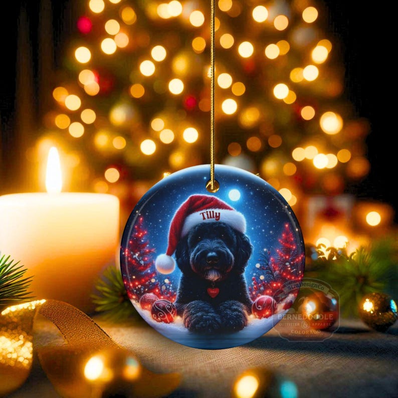 This festive ornament features an adorable black doodle wearing a Santa hat, surrounded by soft glowing holiday lights and rich red Christmas tones. The warm lighting highlights the dog’s fluffy black fur, giving the design a bright, cheerful look that stands out on any tree. A perfect personalized keepsake for anyone who loves black doodles and joyful holiday décor.