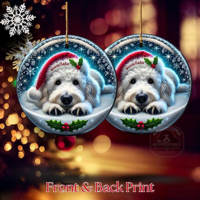 May include: Two round Christmas ornaments featuring a white dog wearing a red Santa hat with the word "Snowflake". The ornaments have a gold string for hanging and are decorated with holly and berries. The text "Front & Back Print" is at the bottom.