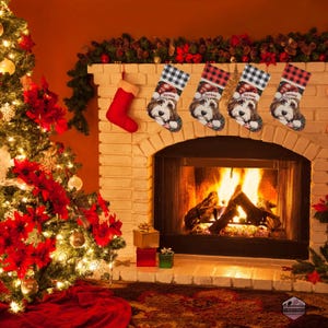 A festive Christmas stocking featuring a whimsical illustrated doodle dog wearing a red Santa hat, surrounded by holiday ornaments and greenery in a warm, detailed Christmas art style. The top of the stocking has a classic red and black buffalo-plaid cuff, and the stocking hangs from a white mantel decorated with evergreen garland and gold ornaments. The stocking design is personalized with your dog’s name, making it a charming and custom holiday décor piece for dog lovers.