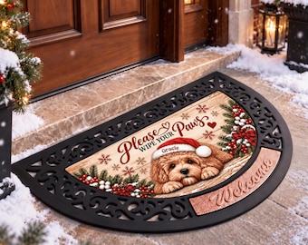 May include: A semi-circular doormat with a black rubber frame and a wood-look center. It features a brown puppy wearing a Santa hat with the name Gracie, red berries, pine branches, snowflakes, and the text Please Wipe Your Paws.