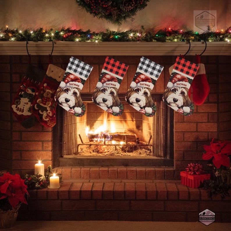 A festive Christmas stocking featuring a whimsical illustrated doodle dog wearing a red Santa hat, surrounded by holiday ornaments and greenery in a warm, detailed Christmas art style. The top of the stocking has a classic red and black buffalo-plaid cuff, and the stocking hangs from a white mantel decorated with evergreen garland and gold ornaments. The stocking design is personalized with your dog’s name, making it a charming and custom holiday décor piece for dog lovers.