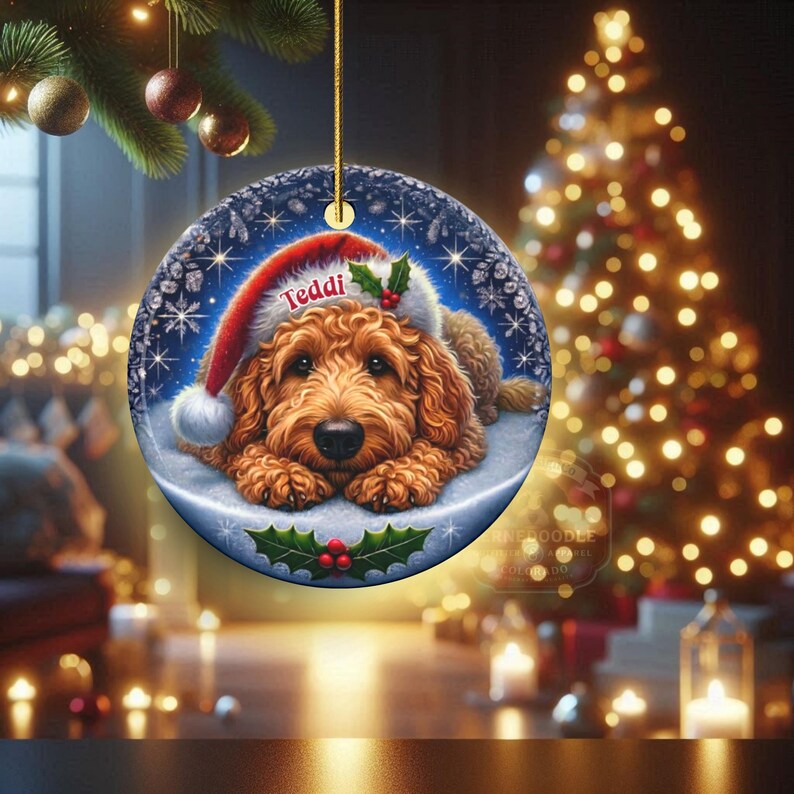 Golden Doodle dog ceramic ornament show hanging with a gold string.  The Goldendoodle Dog ornament measures 3 inches in diameter and is a full gloss, printed on both sides.