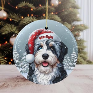 Merle Bernedoodle Ceramic Ornament, showcasing stunning blue and brown eyes. Personalized ornament with your dogs name