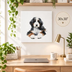 Puede incluir: Un lienzo cuadrado con una ilustraci&oacute;n en acuarela de un cachorro de boyero de Berna con pelaje negro, blanco y marr&oacute;n. La obra de arte est&aacute; etiquetada con el texto 30x30 pulgadas y un peque&ntilde;o s&iacute;mbolo de coraz&oacute;n, exhibida en una pared.