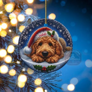 Golden Doodle dog ceramic ornament show hanging with a gold string.  The Goldendoodle Dog ornament measures 3 inches in diameter and is a full gloss, printed on both sides.