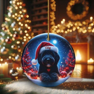This festive ornament features an adorable black doodle wearing a Santa hat, surrounded by soft glowing holiday lights and rich red Christmas tones. The warm lighting highlights the dog’s fluffy black fur, giving the design a bright, cheerful look that stands out on any tree. A perfect personalized keepsake for anyone who loves black doodles and joyful holiday décor.
