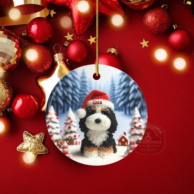 Bernedoodle claymation style ornament made of ceramic, hanging by a gold string.  Winter scene featuring a cute, personalized doodle dog with personalized name on santa hat.  Perfect gift for Bernedoodle Dog Lovers and Pet Enthusiasts.