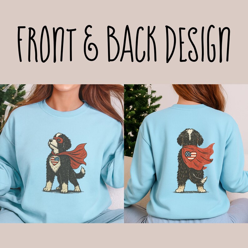 May include: Light blue sweatshirt featuring a superhero dog design on the front and back. The dog wears a red cape and a mask, with an American flag heart. The text "FRONT & BACK DESIGN" is at the top.