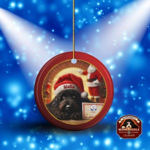 This ceramic ornament features a cute black goldendoodle (or Labradoodle)...Or black bernedoodle dog wearing a Santa hat and being on their best behavior for Santa, surrounded by holiday decorations.  Three inch ceramic dog ornament with a black bernedoodle black golden doodle black goldendoodle dog wearing a santa hat on this cute dog ornament gift.  Perfect ornament for a dog person, dog lover, doodle mom or doodle dad.