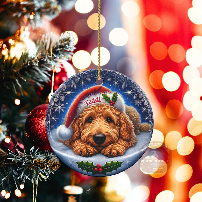 Golden Doodle dog ceramic ornament show hanging with a gold string.  The Goldendoodle Dog ornament measures 3 inches in diameter and is a full gloss, printed on both sides.