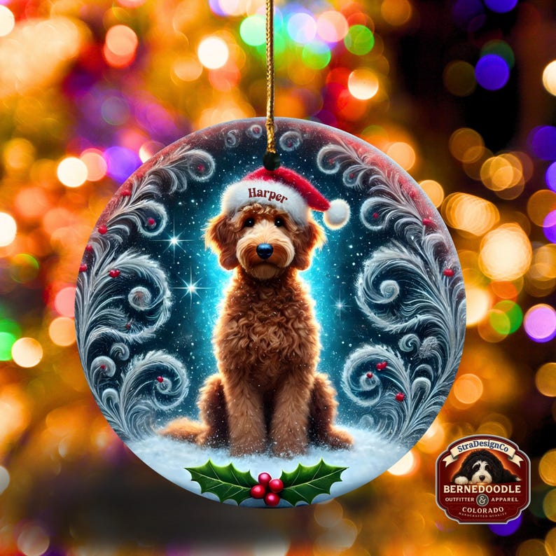 Holiday dog ornament showing a brown goldendoodle in a Santa hat against a snowy, glowing background.