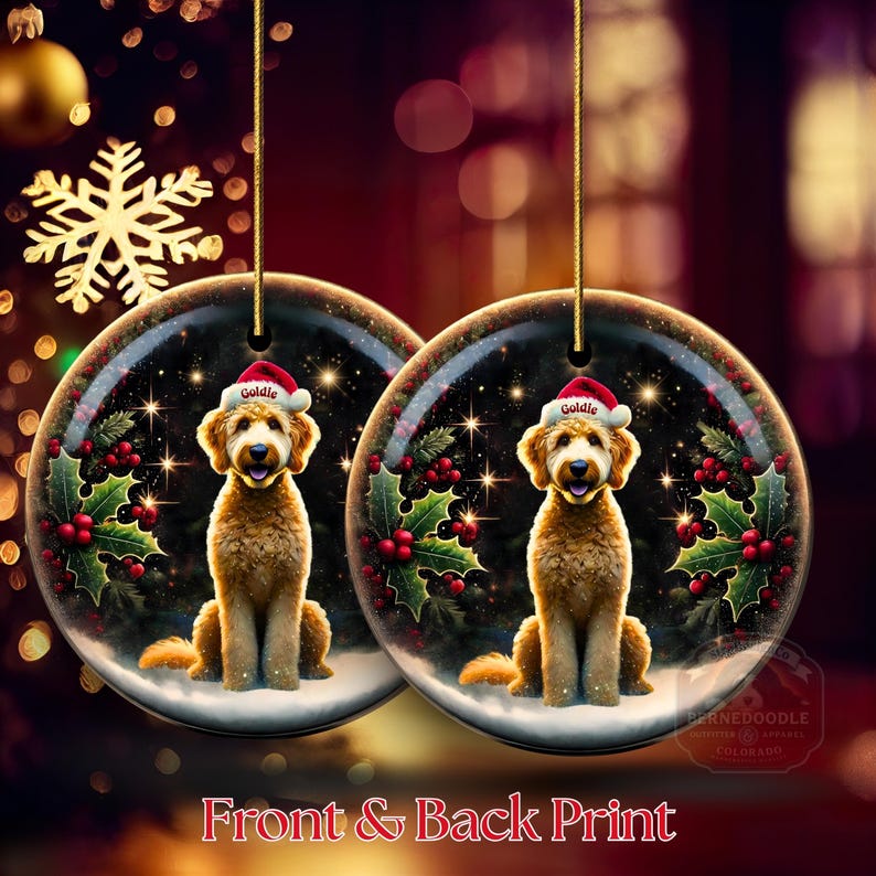 May include: Two round Christmas ornaments with a Goldendoodle dog wearing a Santa hat. The ornaments have a winter scene with holly and berries. The text "Front & Back Print" is at the bottom.