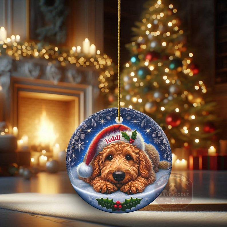 Golden Doodle dog ceramic ornament show hanging with a gold string.  The Goldendoodle Dog ornament measures 3 inches in diameter and is a full gloss, printed on both sides.