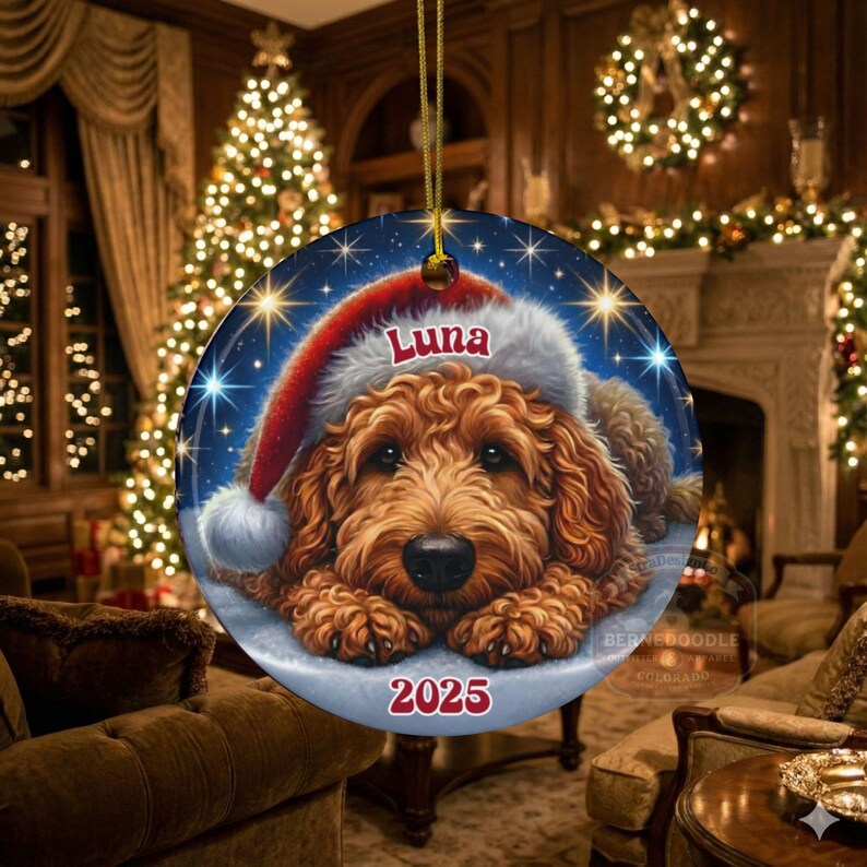 A ceramic ornament of a goldendoodle dog wearing a Santa hat, personalized with the dog's name and the year.  Gorgeously placed in a warm background with candles and Christmas lights.