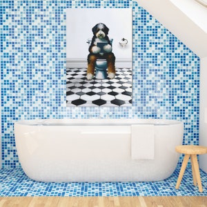 May include: A rectangular wall art print featuring a Bernese Mountain Dog sitting on a white toilet, holding a tablet. The dog has black, white, and brown fur. The background shows a white wall and a floor with a black and white hexagonal tile pattern.