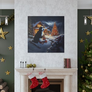 May include: A square wall art print depicting a black and white Bernese Mountain Dog sitting in a snowy landscape at night. The scene features a glowing cabin, a decorated Christmas tree with lights, and wrapped gifts on the ground.