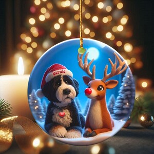 A fluffy Bernedoodle sits beside a gentle reindeer with a glowing red nose in a snowy winter forest. Soft blue and golden holiday lighting highlights the animals as snow falls around them. The Bernedoodle’s expressive face and the reindeer’s warm glow create a peaceful, magical Christmas scene perfect for woodland and dog-themed holiday décor.