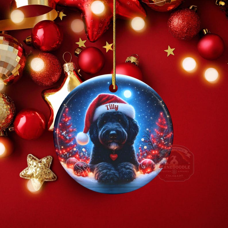 This festive ornament features an adorable black doodle wearing a Santa hat, surrounded by soft glowing holiday lights and rich red Christmas tones. The warm lighting highlights the dog’s fluffy black fur, giving the design a bright, cheerful look that stands out on any tree. A perfect personalized keepsake for anyone who loves black doodles and joyful holiday décor.