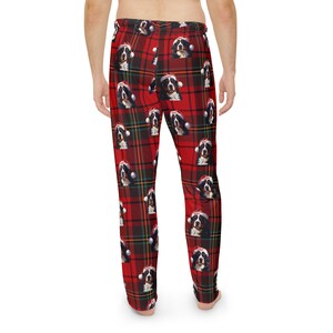 Men's pajama pants lounge wear personalized Christmas pajama bottoms with Bernese Mountain dogs wearing Santa Hat and their name is on the Santa Hat.  Bernese Mountain Dog dad gear!