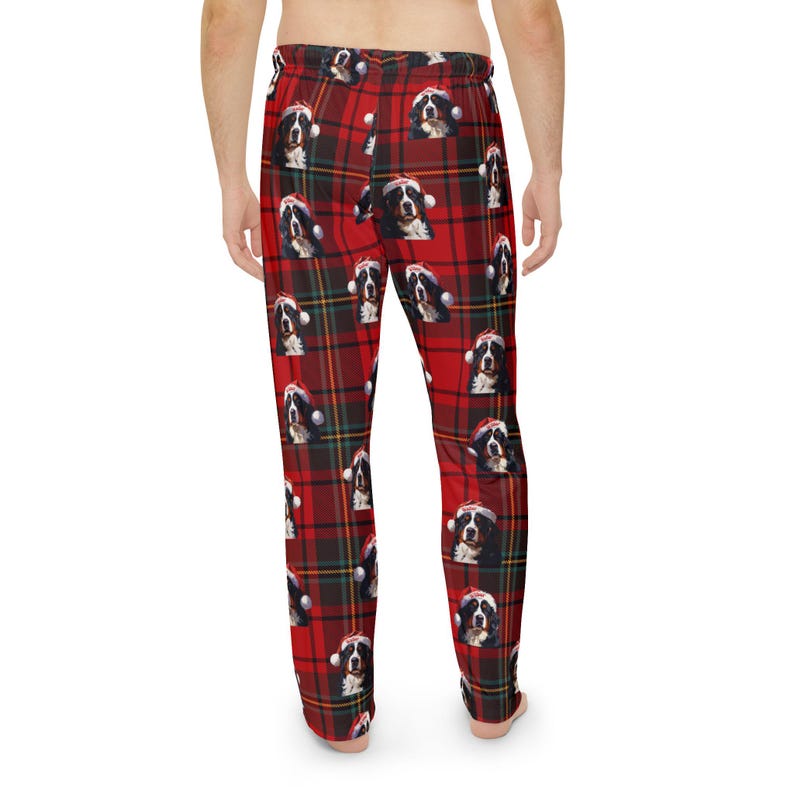 Men's pajama pants lounge wear personalized Christmas pajama bottoms with Bernese Mountain dogs wearing Santa Hat and their name is on the Santa Hat.  Bernese Mountain Dog dad gear!