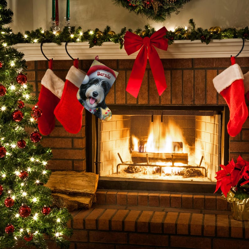 Bernedoodle Christmas stocking with a cute black and white dog wearing a Santa hat and smiling, personalized with the name ‘Bernie’. Festive holiday background with candy canes, lights, and ornaments — perfect personalized dog lover gift, Bernedoodle holiday décor, or custom pet Christmas stocking.