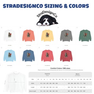 May include: A product image featuring a variety of sweatshirts in different colors, each displaying a dog with angel wings. The image includes sizing charts in inches and centimeters, and the text "STRADESIGNCO SIZING & COLORS".