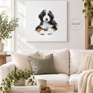 Puede incluir: Un lienzo cuadrado con una ilustraci&oacute;n en acuarela de un cachorro de boyero de Berna con pelaje negro, blanco y marr&oacute;n. La obra de arte est&aacute; etiquetada con las dimensiones 24x24 pulgadas y muestra al cachorro en posici&oacute;n sentada.