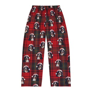 Men's pajama pants lounge wear personalized Christmas pajama bottoms with Bernese Mountain dogs wearing Santa Hat and their name is on the Santa Hat.  Bernese Mountain Dog dad gear!