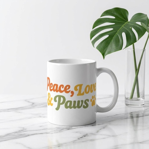 Peace, Love & Paws mug | Retro floral paw print coffee cup