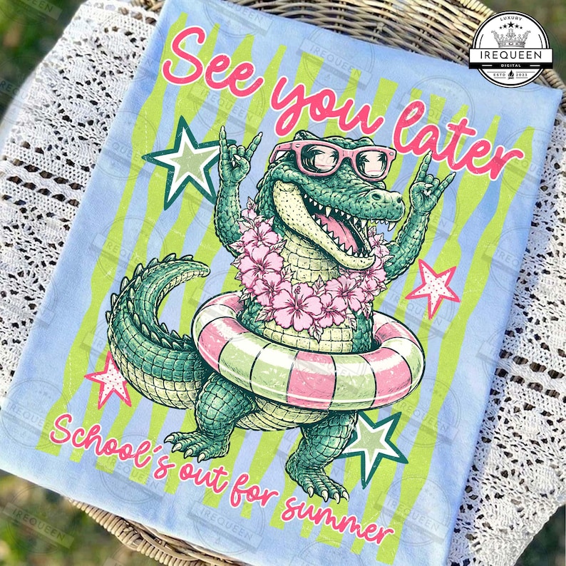 May include: A light blue graphic t-shirt featuring a cartoon alligator wearing sunglasses, a flower lei, and a pink and green striped inner tube. The text "See you later" and "School's out for summer" are also on the shirt.