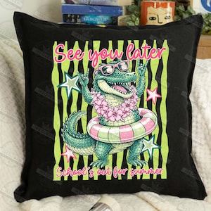 May include: Black square pillow with a cartoon alligator wearing sunglasses, a flower lei, and a pink and white striped inner tube. Text reads "See you later" and "School's out for summer" in pink and yellow.