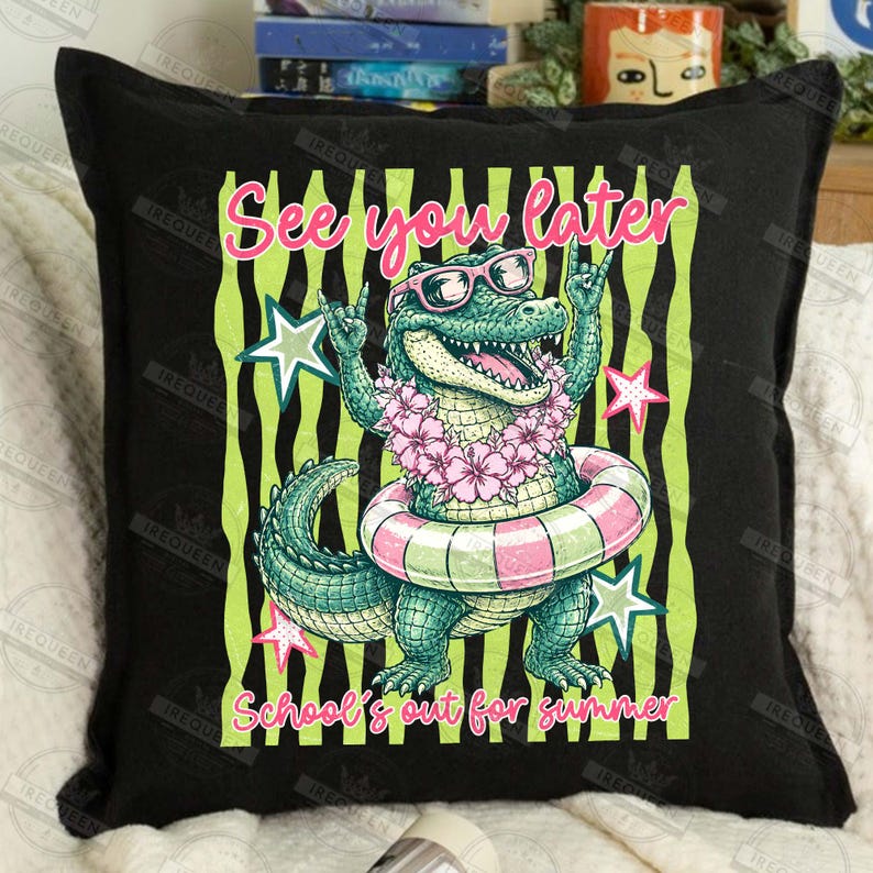 May include: Black square pillow with a cartoon alligator wearing sunglasses, a flower lei, and a pink and white striped inner tube. Text reads "See you later" and "School's out for summer" in pink and yellow.