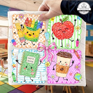 May include: A white square fabric item featuring a colorful four-panel grid design with a large pink bow in the center. The illustrations include a smiling pencil, crayons, a red apple, a green notebook labeled NOTE BOOK, and a coffee cup.