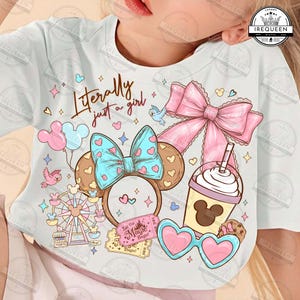 May include: White t-shirt featuring a whimsical design with the text "Literally just a girl." The design includes a Minnie Mouse ear headband with a blue bow, pink heart-shaped sunglasses, a Ferris wheel, and a pink bow.