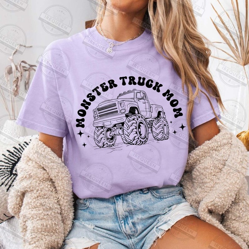 May include: A lavender t-shirt with a black graphic of a monster truck and the text "Monster Truck Mom".