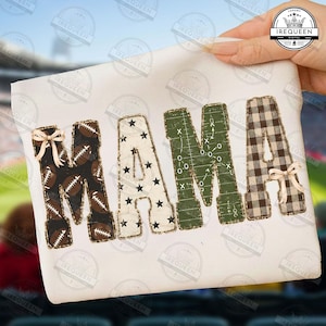 May include: A white t-shirt featuring the word MAMA in large block letters. The first letter M has a football pattern with a small bow, the A has a black star pattern, the second M is green with football play diagrams, and the last A is brown plaid with a bow.
